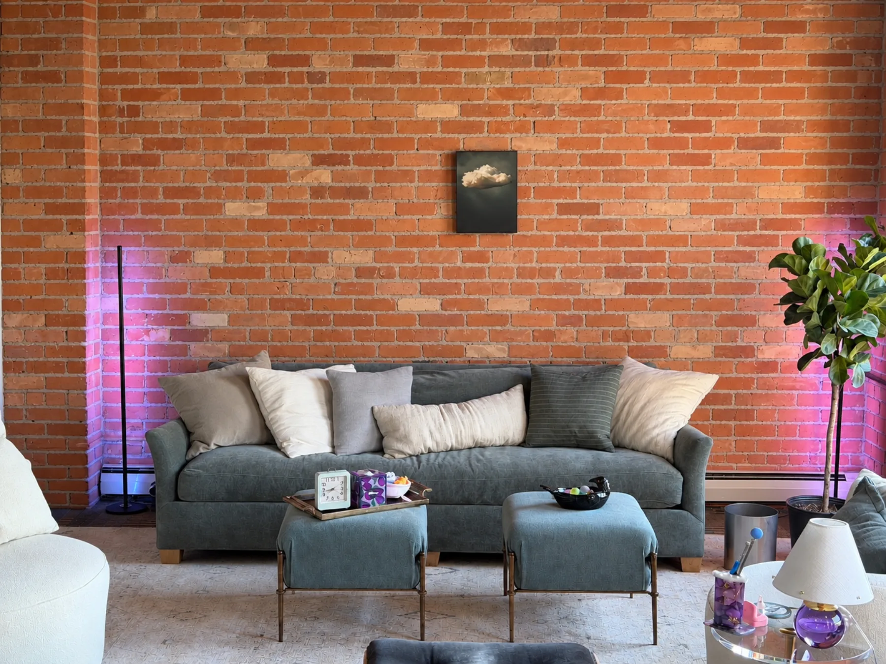 The therapy room at evoke psychotherapy, window light falling across a sofa